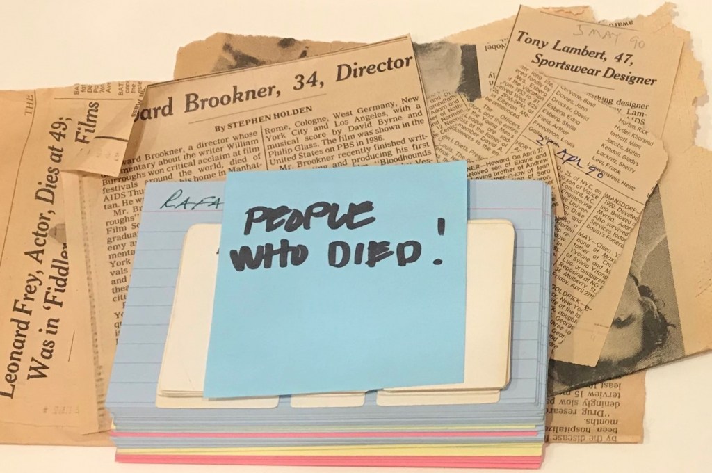 Newspaper clippings and business cards of contacts who died from AIDS, source: the Larry Kramer Papers, Beinecke Rare Book and Manuscript LIbrary